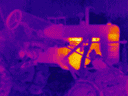 Infrared-to-visual image of a tractor--You can see "through" the tarp